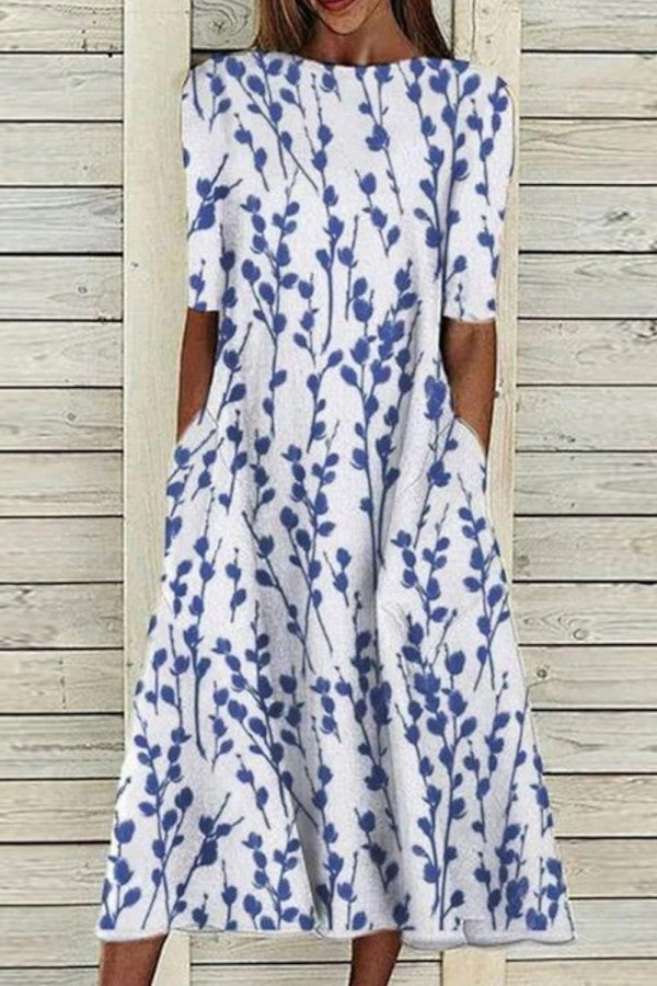 Flora midi dress with round neckline and half sleeves featuring a botanical print, perfect for spring and summer occasions. 0
