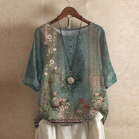 Bella women's vintage floral print blouse with short sleeves and a round neckline. 0