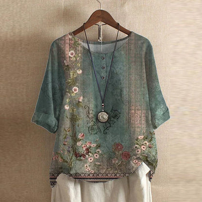 Bella women's vintage floral print blouse with short sleeves and a round neckline. 0