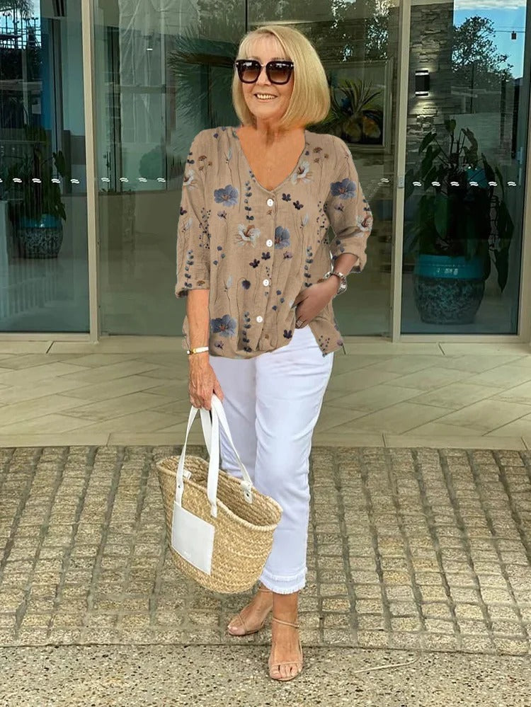 Bella women's blouse with three-quarter sleeves and a V-neckline featuring button closure, perfect for versatile styling and comfortable wear. 1